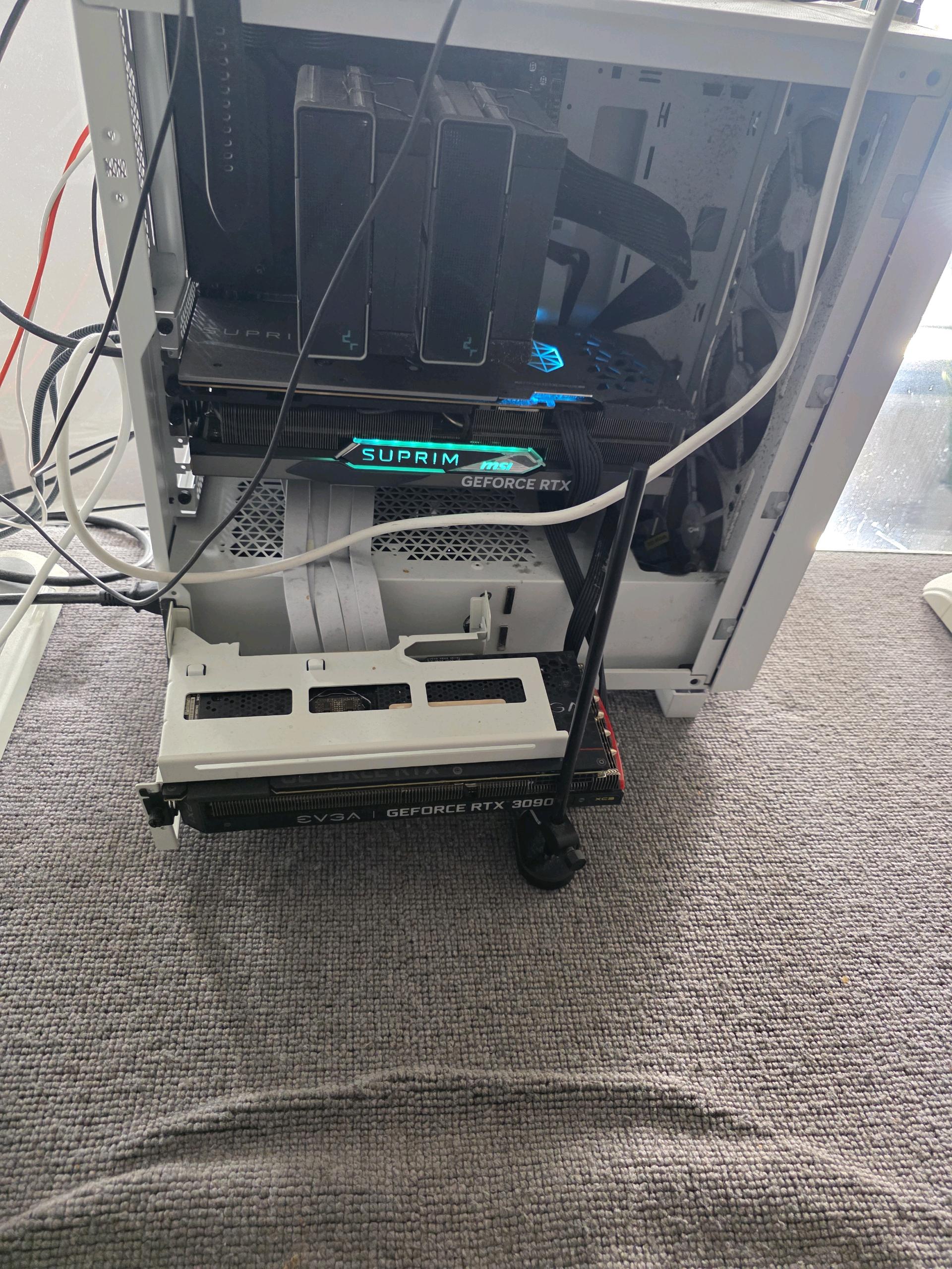 The rig — MSI SUPRIM 4090 and EVGA 3090, open case, cables everywhere. Jank, but it worked.